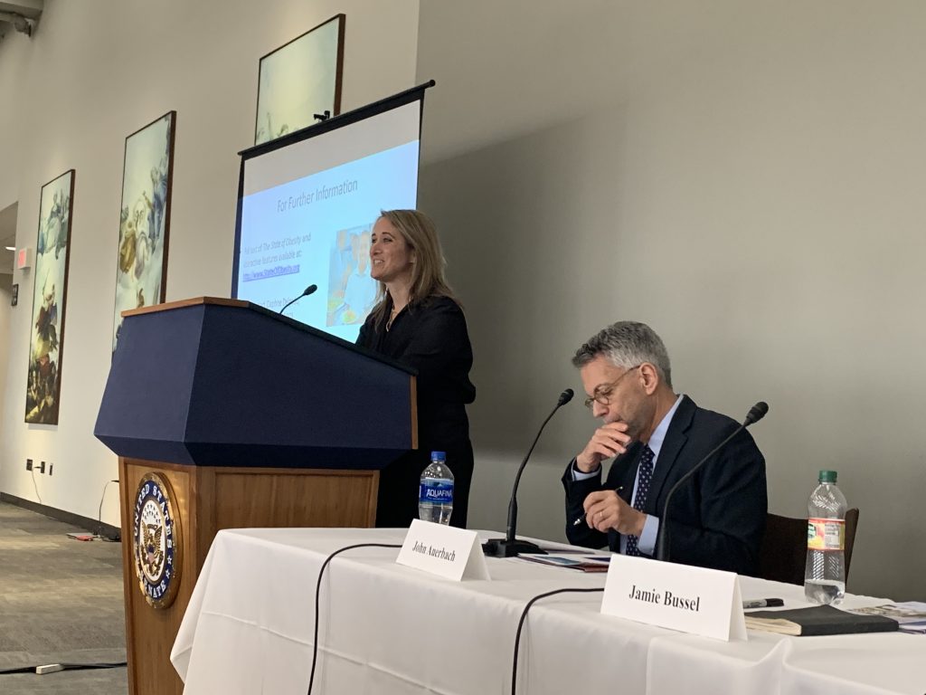 Speaker presenting on the hill