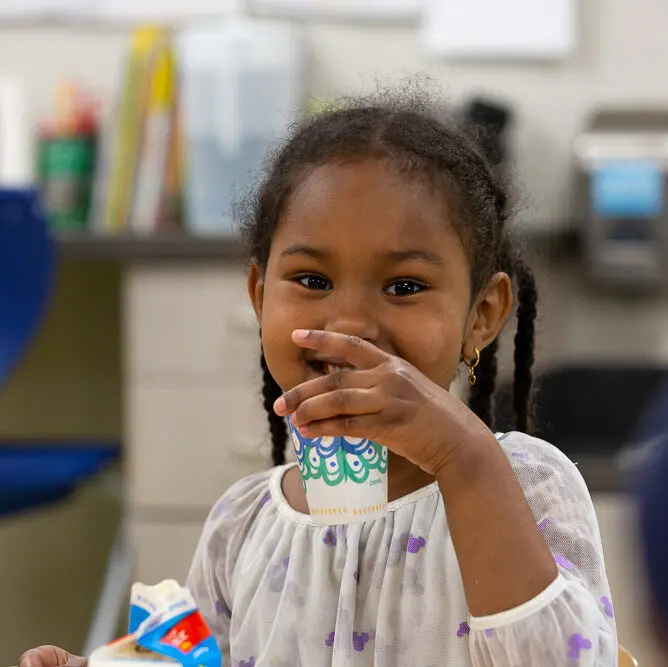 https://stateofchildhoodobesity.org/wp-content/uploads/2022/09/Girl-drinking-from-a-cup-and-a-carton-aspect-ratio-720-720-jpg.webp